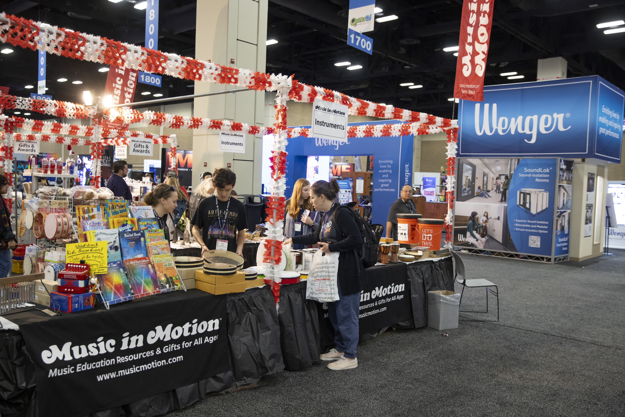 People visit an exhibit booth