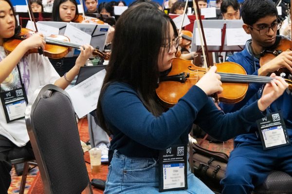 All-State students rehearse with their badges visible