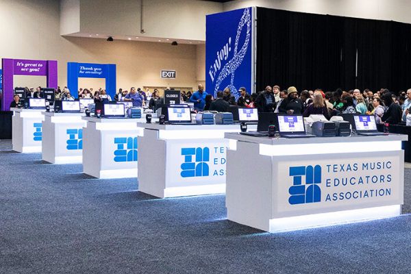 A row of registration kiosks at the TMEA convention